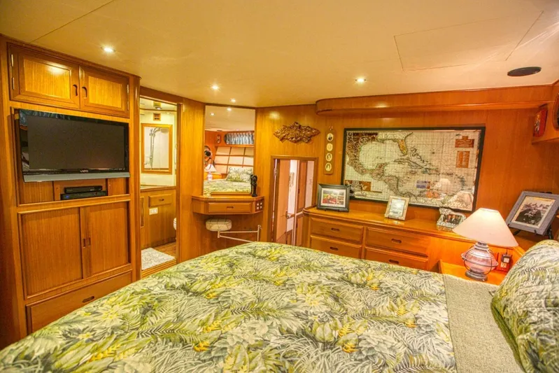 The Cotton Picker Yacht Photos Pics Luxurious cabin interior of 2000 Ocean Alexander 610 Pilothouse yacht with wood finishes and decor.