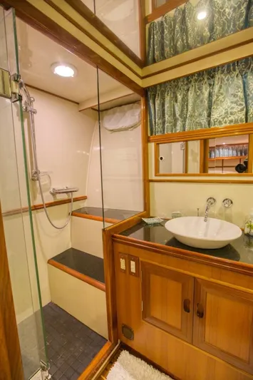 The Cotton Picker Yacht Photos Pics Luxurious bathroom in 2000 Ocean Alexander 610 Pilothouse yacht with shower and elegant sink.