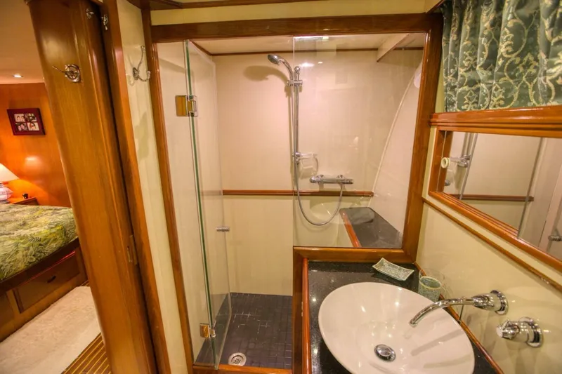 The Cotton Picker Yacht Photos Pics Luxurious bathroom in 2000 Ocean Alexander 610 Pilothouse yacht with shower and sink.