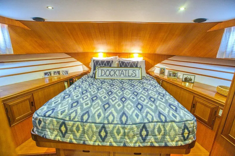 The Cotton Picker Yacht Photos Pics Luxurious cabin interior of 2000 Ocean Alexander 610 Pilothouse yacht with cozy bedding.