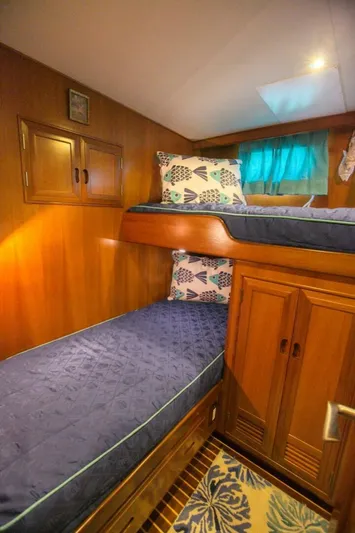 The Cotton Picker Yacht Photos Pics Cozy cabin with bunk beds in 2000 Ocean Alexander 610 Pilothouse yacht.