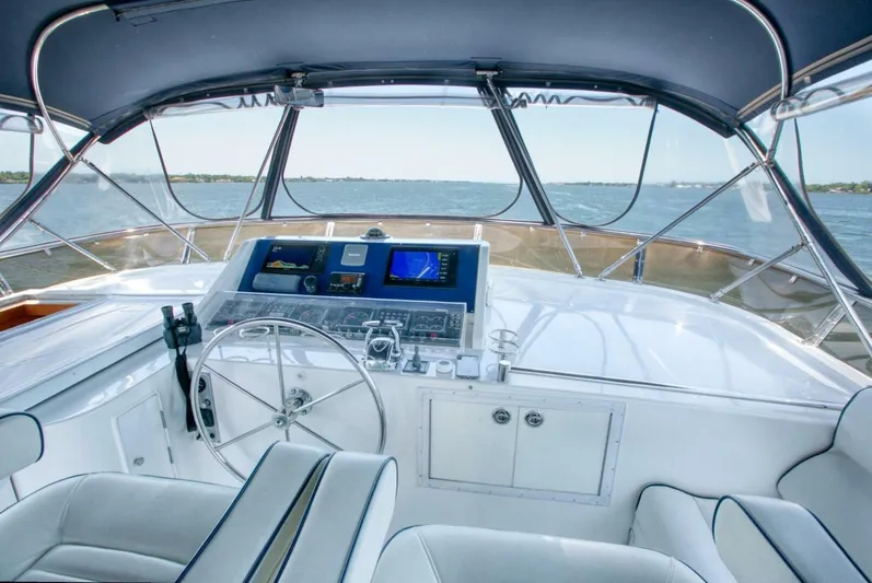 The Cotton Picker Yacht Photos Pics Pilothouse of 2000 Ocean Alexander 610 yacht with navigation equipment and ocean view.