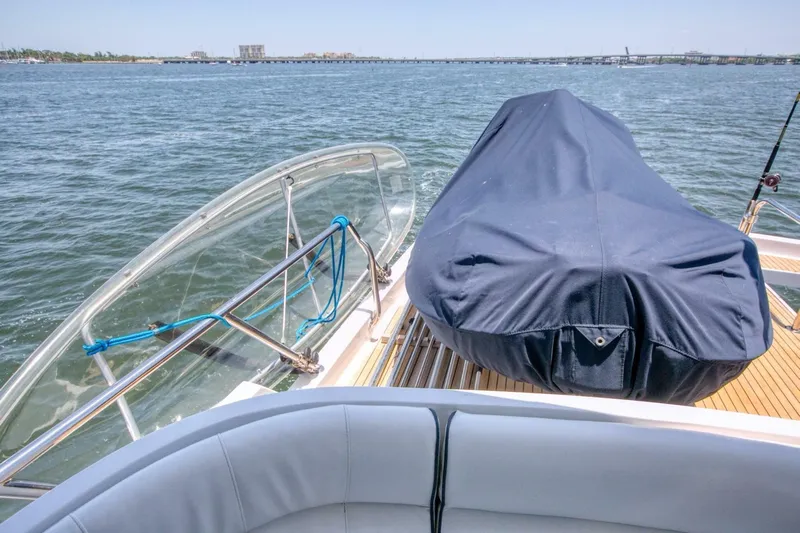 The Cotton Picker Yacht Photos Pics Ocean Alexander 610 Pilothouse yacht deck with covered equipment, 2000 model, on open water.