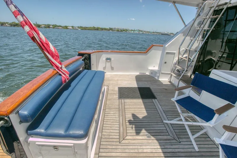 The Cotton Picker Yacht Photos Pics Deck of 2000 Ocean Alexander 610 Pilothouse yacht with seating and ocean view.