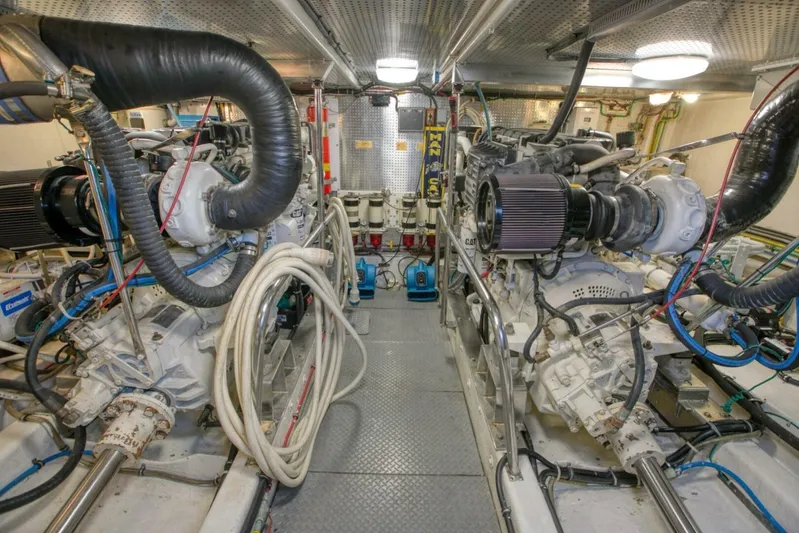 The Cotton Picker Yacht Photos Pics Engine room of 2000 Ocean Alexander 610 Pilothouse yacht, featuring dual engines and equipment.