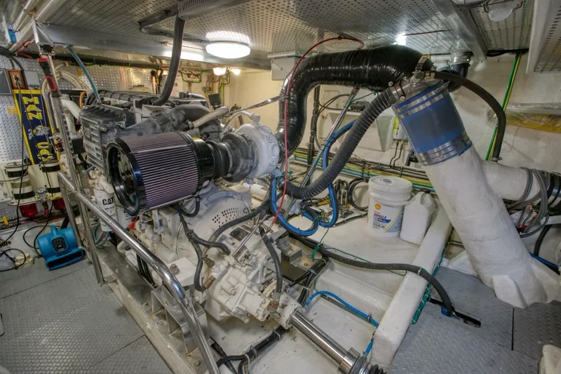 The Cotton Picker Yacht Photos Pics Engine room of 2000 Ocean Alexander 610 Pilothouse yacht, featuring detailed mechanical components.