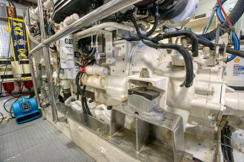 The Cotton Picker Yacht Photos Pics Engine room of 2000 Ocean Alexander 610 Pilothouse yacht, featuring CAT machinery and equipment.