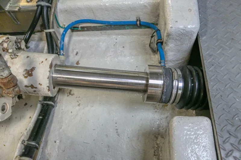 The Cotton Picker Yacht Photos Pics Engine room detail of a 2000 Ocean Alexander 610 Pilothouse yacht, showing mechanical components.