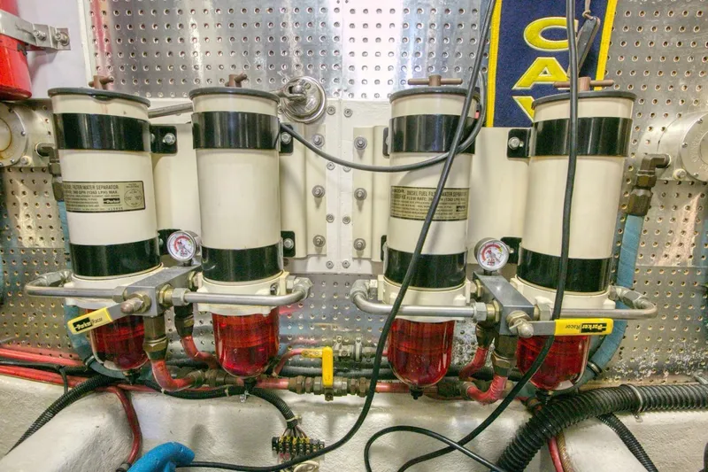 The Cotton Picker Yacht Photos Pics Engine room of 2000 Ocean Alexander 610 Pilothouse with fuel filters and gauges.
