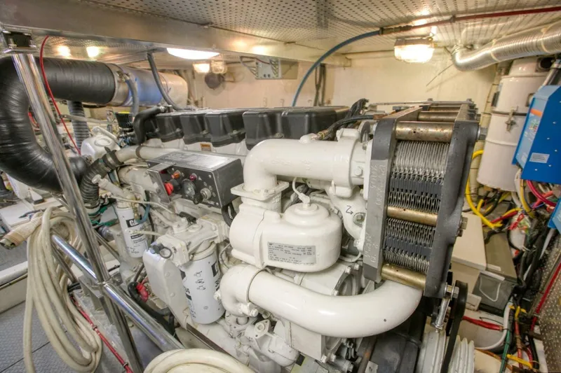 The Cotton Picker Yacht Photos Pics Engine room of 2000 Ocean Alexander 610 Pilothouse yacht, showcasing machinery and components.