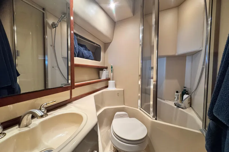  Yacht Photos Pics Luxurious bathroom in 2006 Meridian 490 Pilothouse yacht with modern fixtures and shower.