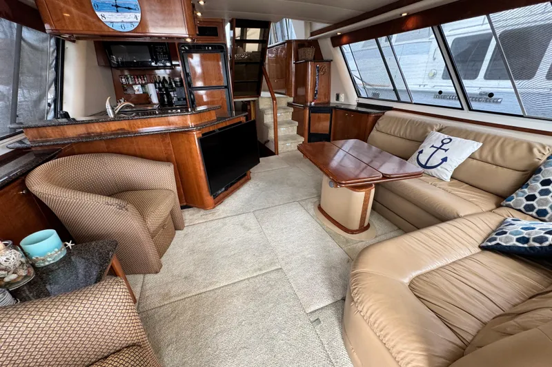  Yacht Photos Pics Luxurious interior of 2006 Meridian 490 Pilothouse yacht with elegant seating and decor.