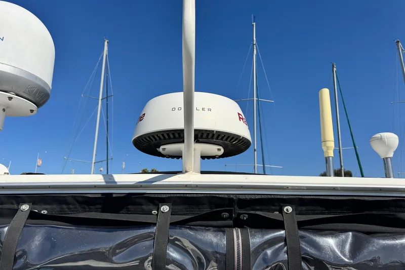  Yacht Photos Pics Radar equipment on a 2006 Meridian 490 Pilothouse against a clear blue sky.