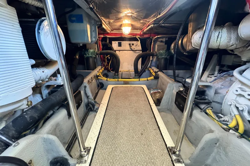  Yacht Photos Pics Engine room of 2006 Meridian 490 Pilothouse yacht, featuring mechanical components and wiring.