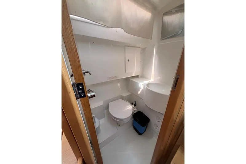 Marylin Yacht Photos Pics Bathroom interior of 2018 Beneteau Oceanis 48 yacht, featuring modern fixtures and compact design.