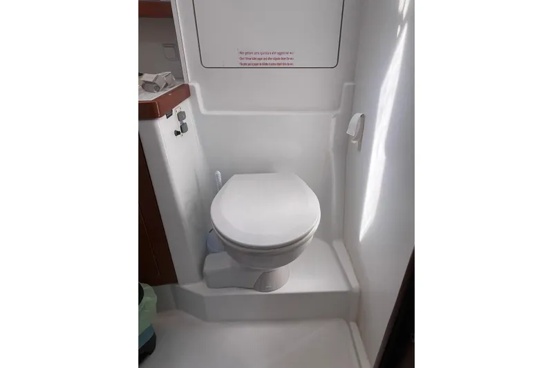 Marylin Yacht Photos Pics Beneteau Oceanis 48 (2018) yacht bathroom with compact toilet and modern design.