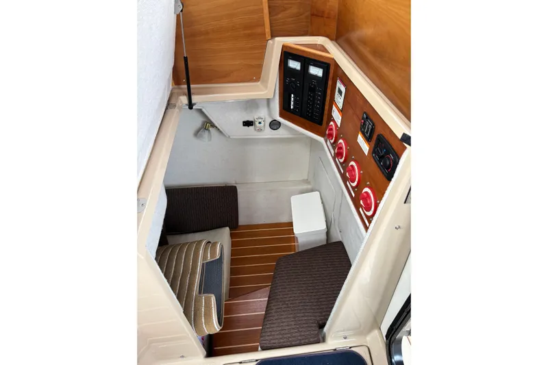 "salt Shaker" Yacht Photos Pics 2013 Cutwater C-28 cabin interior with control panel and seating area.