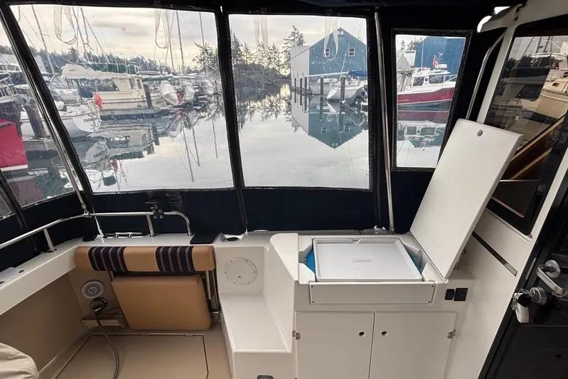 "salt Shaker" Yacht Photos Pics 2013 Cutwater C-28 boat interior with marina view through windows.