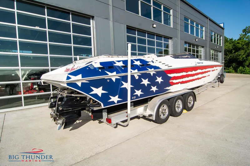  Yacht Photos Pics 2005 Fountain 42 Executioner boat with American flag design on trailer at Big Thunder Marine.