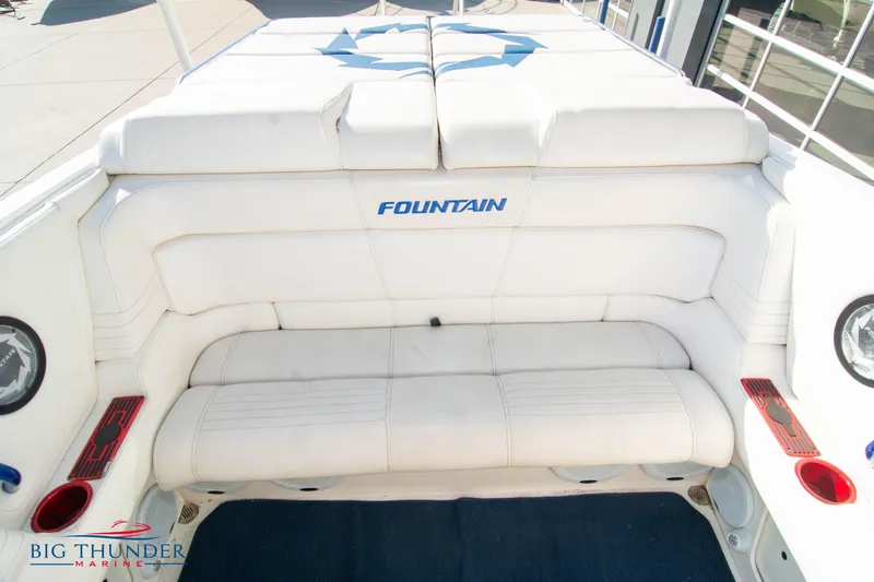  Yacht Photos Pics 2005 Fountain 42 Executioner boat with white seating and logo.