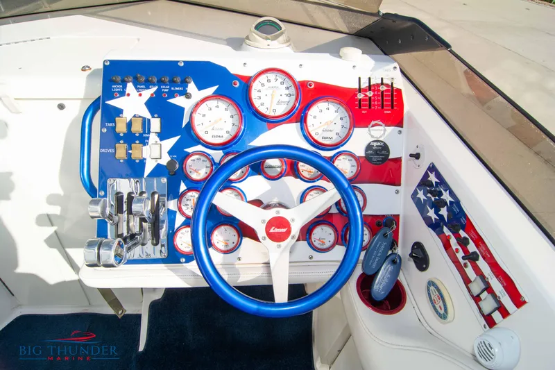  Yacht Photos Pics 2005 Fountain 42 Executioner boat dashboard with patriotic theme and advanced controls.