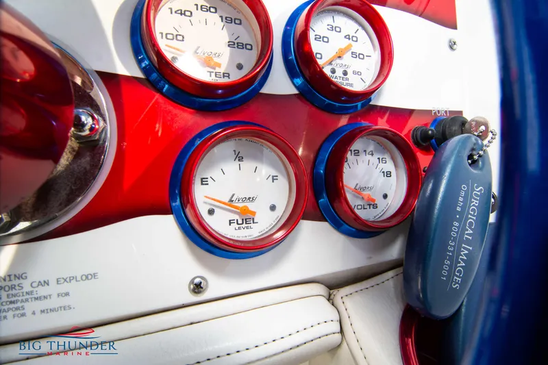  Yacht Photos Pics Close-up of 2005 Fountain 42 Executioner boat dashboard with gauges and key.