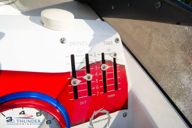  Yacht Photos Pics Control panel of a 2005 Fountain 42 Executioner boat with drive and tab levers.