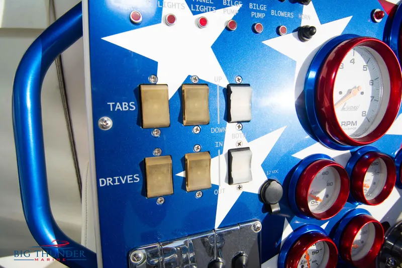  Yacht Photos Pics Close-up of 2005 Fountain 42 Executioner boat control panel with switches and gauges.