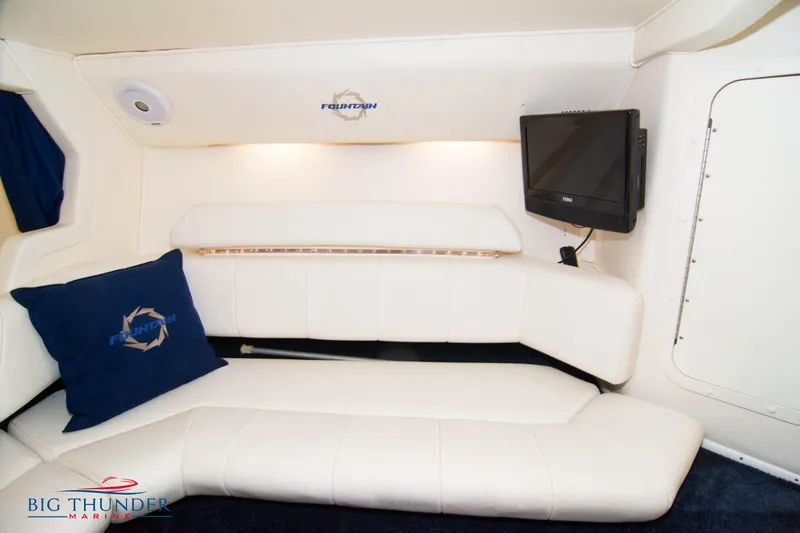  Yacht Photos Pics Interior cabin of a 2005 Fountain 42 Executioner boat with white leather seating.