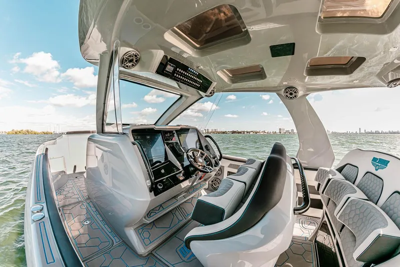  Yacht Photos Pics Luxurious 2027 Deep Impact 399 Fwd Cabin boat interior with advanced navigation system.