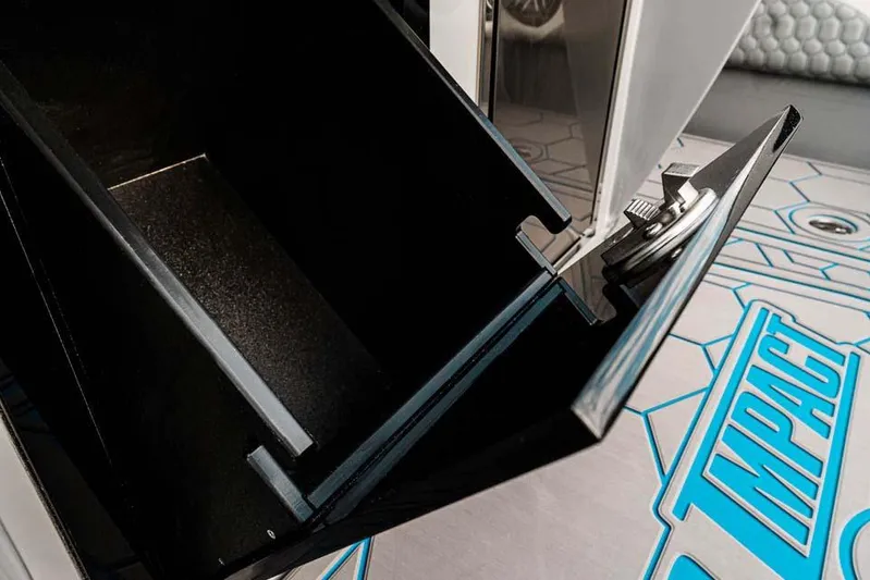  Yacht Photos Pics Open storage compartment on 2027 Deep Impact 399 Fwd Cabin boat, showcasing interior details.