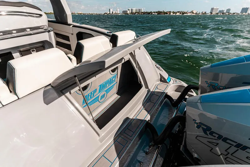  Yacht Photos Pics 2027 Deep Impact 399 Fwd Cabin boat on water, showcasing sleek design and powerful engines.