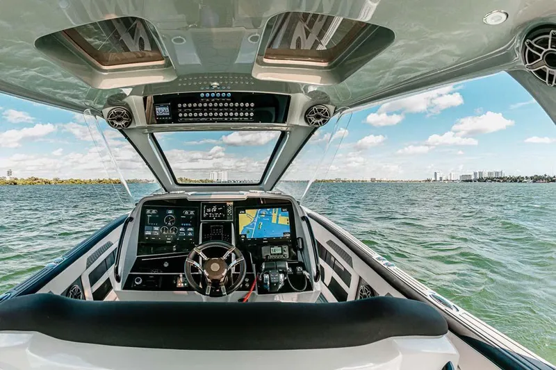  Yacht Photos Pics Interior view of 2027 Deep Impact 399 Fwd Cabin boat, featuring advanced navigation systems.