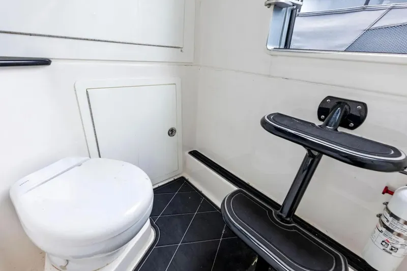  Yacht Photos Pics Interior of 2027 Deep Impact 399 Fwd Cabin boat bathroom with toilet and step.