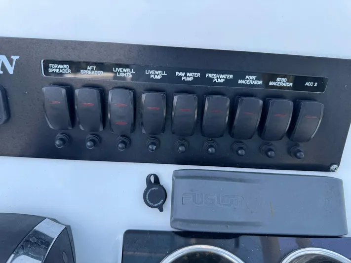  Yacht Photos Pics Control panel of a 2021 Blackfin 252 CC boat with labeled switches.