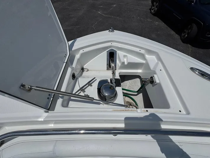  Yacht Photos Pics Open anchor compartment on 2021 Blackfin 252 CC boat, showing anchor and chain storage.