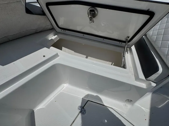  Yacht Photos Pics Open storage compartment on a 2021 Blackfin 252 CC boat, showing interior details.