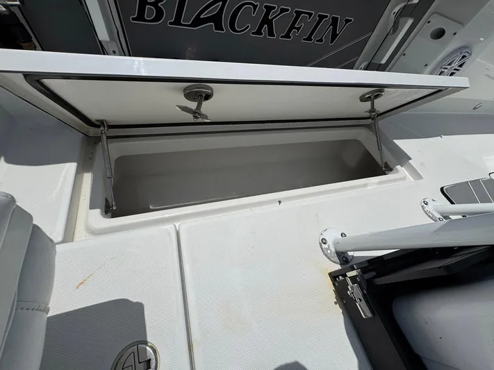  Yacht Photos Pics Open storage compartment on a 2021 Blackfin 252 CC boat deck.