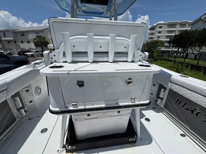  Yacht Photos Pics 2021 Blackfin 252 CC boat interior with fishing rod holders and storage compartment.