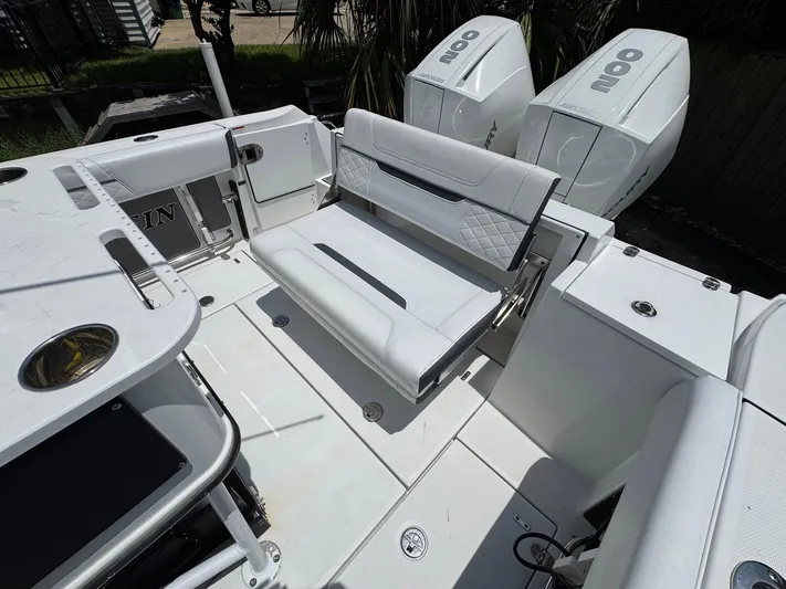  Yacht Photos Pics 2021 Blackfin 252 CC boat interior with seating and dual outboard engines.