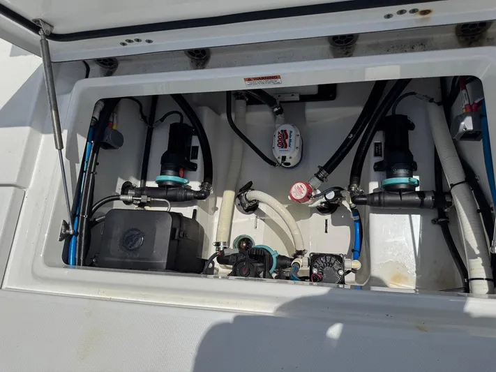  Yacht Photos Pics 2021 Blackfin 252 CC boat compartment with pumps and wiring.