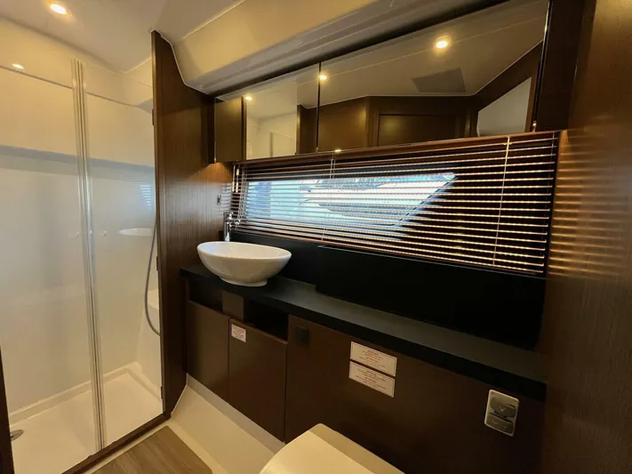 Inventory Clearance Yacht Photos Pics Luxurious bathroom interior of 2023 Bavaria R40 Coupe yacht with modern fixtures and elegant design.