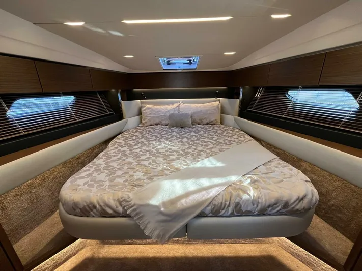 Inventory Clearance Yacht Photos Pics Luxurious bedroom interior of 2023 Bavaria R40 Coupe yacht with elegant bedding and ambient lighting.