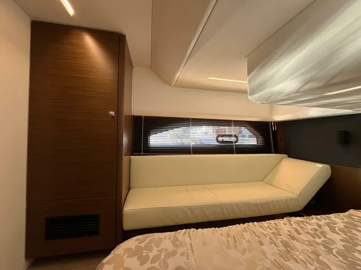 Inventory Clearance Yacht Photos Pics Luxurious interior of 2023 Bavaria R40 Coupe with beige sofa and modern design.