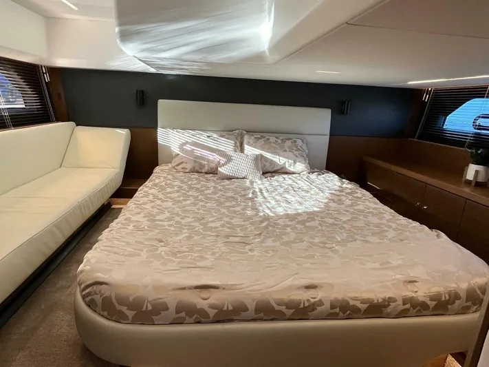 Inventory Clearance Yacht Photos Pics Luxurious bedroom interior of 2023 Bavaria R40 Coupe yacht with elegant bedding and modern design.