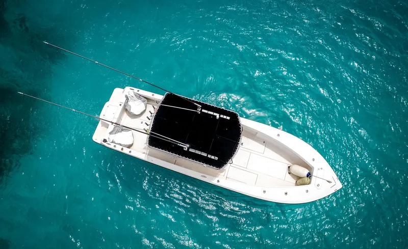  Yacht Photos Pics Aerial view of 2006 SeaVee 34 CC boat on turquoise water.