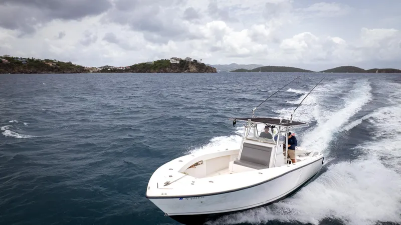  Yacht Photos Pics 2006 SeaVee 34 CC boat cruising on open water under cloudy skies.