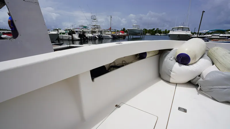  Yacht Photos Pics 2006 SeaVee 34 CC boat docked, featuring deck view with fenders and marina background.