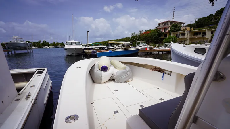  Yacht Photos Pics 2006 SeaVee 34 CC boat docked in a marina with other vessels under a clear sky.