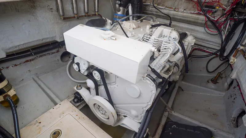  Yacht Photos Pics Engine compartment of a 2006 SeaVee 34 CC boat, showcasing mechanical components and wiring.